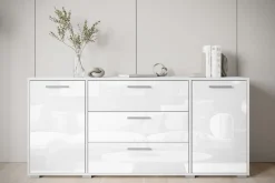 Komody></noscript>BRATEX Biała komoda z szufladami do salonu 150 cm BUENO połysk biały